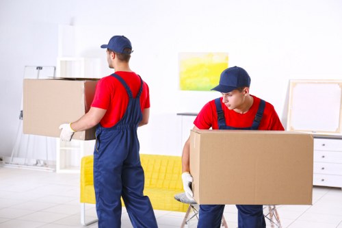 Removal team sorting recyclable packing materials during a sustainable move