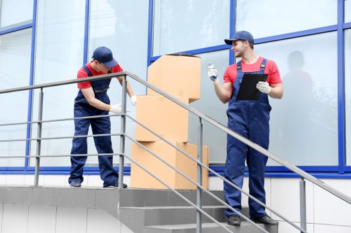 Professional movers loading furniture for a house move
