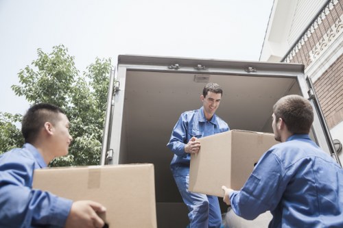 Office movers preparing desks and packing crates for an Irish business relocation