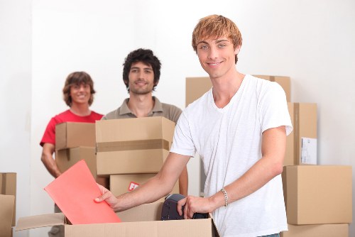 Commercial relocation with desks and IT equipment prepared for transport