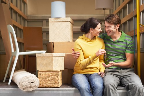 Movers carrying household items through a typical Irish property entrance